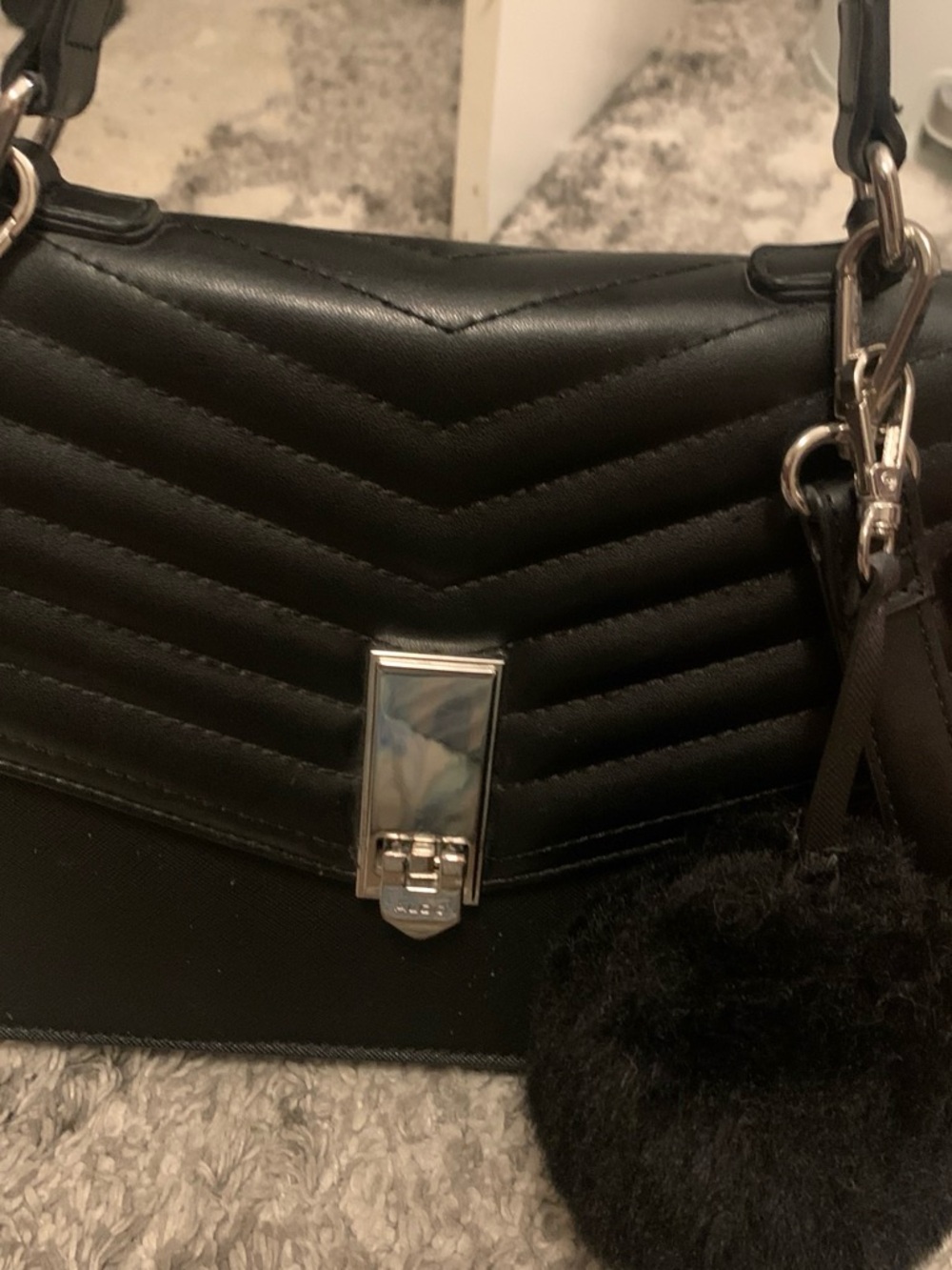 Aldo Black Quilted Shoulder Bag with Silver Hardware and Pom-Pom